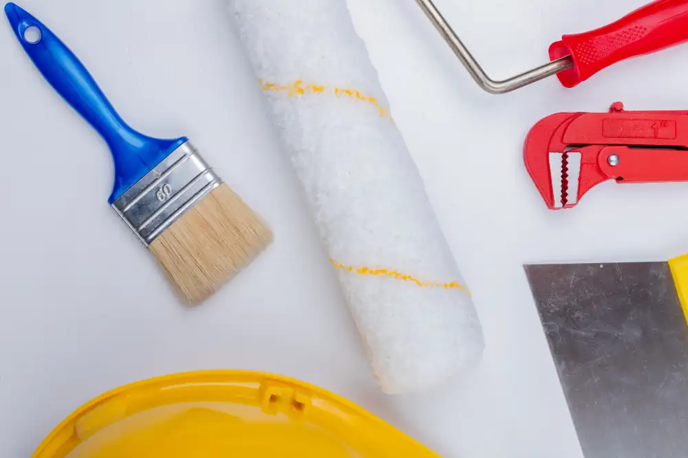 Brocha, rodillo, espátula y herramientas para trabajos de pintura interior